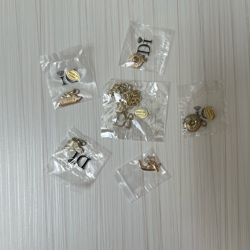 NWT Diamonds International Gold Charms with Bracelet Set